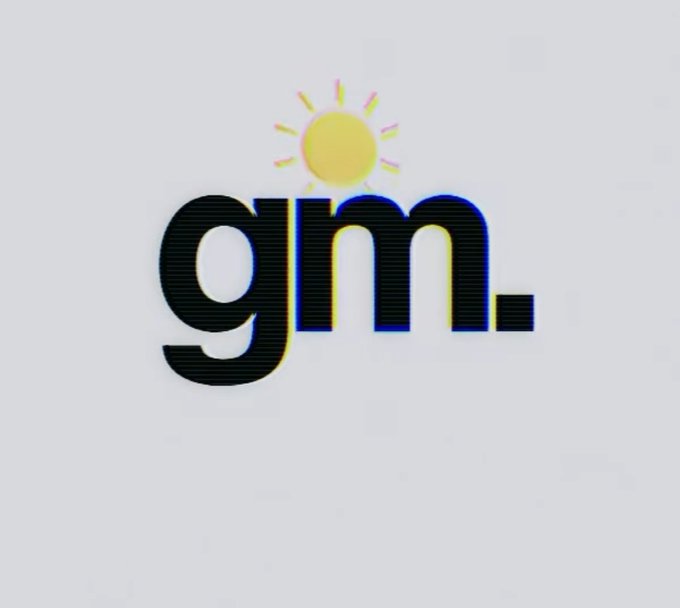 The image shows a logo for a company named GM. The logo consists of the word "GM" written in black letters against a white background. Below the main text, there's an illustration of a sun with rays coming out from behind it. This design choice adds a touch of creativity and visual interest to the logo.