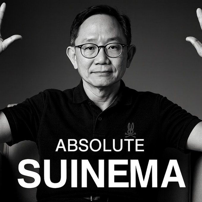 A black-and-white portrait of a smiling man with glasses posing with arms raised, wearing a black polo shirt featuring a small bunny skull-and-crossbones logo above the bold white text "ABSOLUTE SUINEMA"—a witty play on Sui Network branding that pairs with a teaser of upcoming Sui ecosystem launches like Hashi testnet, SuiPlay updates, DeepBook's Predict App, and SuiBallo shipping.