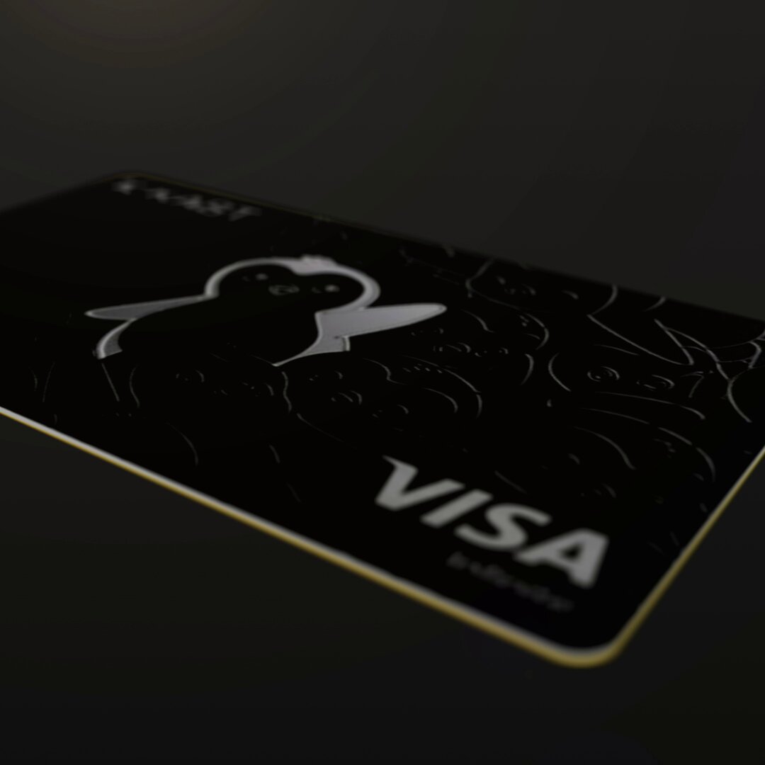 The image features a black and white Visa credit card with a penguin design on its front. The card has a gold stripe running down the center, making it stand out against the dark background. The text "GKast" appears at the top of the card, while "The KAST Pengu" is written below it. The card's design includes a penguin and the words "Visa Infinite", indicating that this card can be used for any Visa transactions without restrictions or limitations. Additionally, there are two points listed on the card, which could be earned by using the card at participating merchants.
