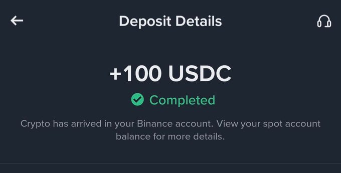 A Binance deposit confirmation screen showing '+100 USDC ✓ Completed' with text 'Crypto has arrived in your Binance account. View your spot account balance for more details.'