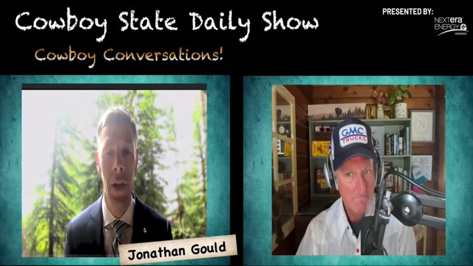 A screenshot from the "Cowboy State Daily Show" titled "Cowboy Conversations!" featuring a video call between Jonathan Gould and a host wearing a GMC Trucks cap, likely discussing digital asset regulatory developments. The accompanying post about US Comptroller and Trump administration priorities for American digital asset innovation and Wyoming's role as a regulatory model aligns with the show's likely discussion topic.