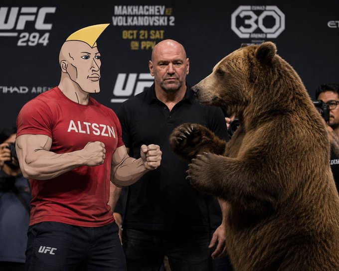 The image shows a UFC 294 press event with Dana White standing between a cartoon muscular figure wearing an "ALTSZN" t-shirt and a large brown bear in a fighting stance, with promotional text for "MAKHACHEV vs VOLKANOVSKI 2" visible in the background. The staged scene humorously visualizes the "Go get dem bears" rallying cry, depicting an over-the-top face-off meant to energize the ALTSZN community.