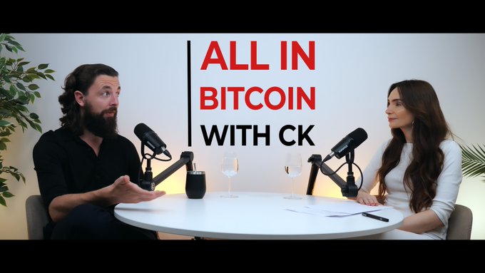 A podcast or interview scene with a man and woman seated at a table with microphones, with text overlay reading "ALL IN BITCOIN WITH CK."