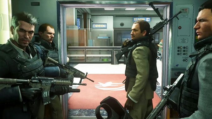 A scene from a video game showing armed tactical operatives in military gear holding rifles inside what appears to be a facility corridor.