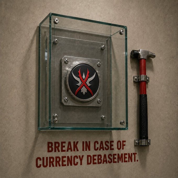 A glass display case mounted on a wall containing an emblem, with a red and black hammer hanging beside it and text reading 'BREAK IN CASE OF CURRENCY DEBASEMENT.'