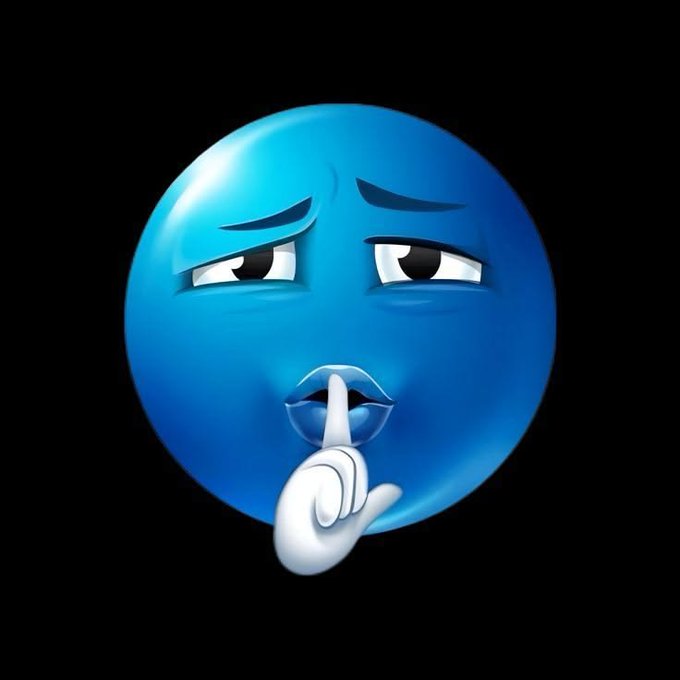 The image features a blue character with a sad expression, as if it's crying or frowning. It has a white circle around its mouth, which could be interpreted as "shh" (Silence), indicating that someone should keep quiet. The background is black, making the blue character stand out even more and emphasizing its sad demeanor.