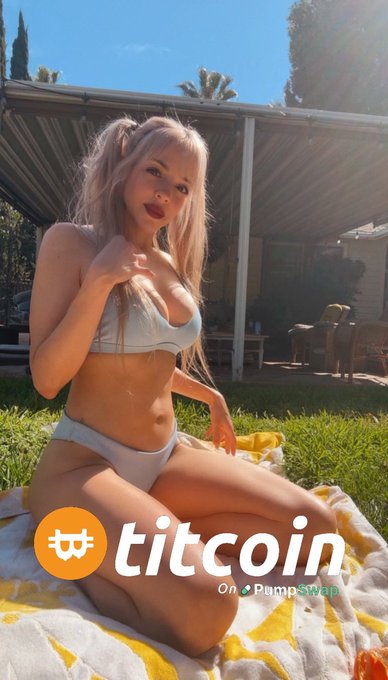 A woman in a white bikini sitting on a yellow and white towel outdoors with the 'titcoin On PumpSwap' logo displayed at the bottom.