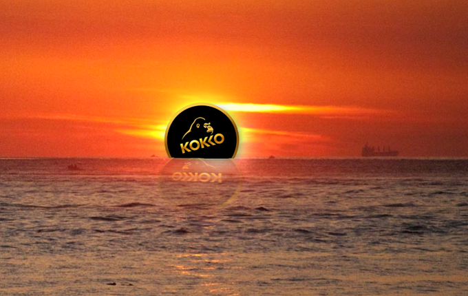 A vibrant orange sunset over the ocean with a black Kokopelli logo reading 'KOKKO' superimposed in the center.