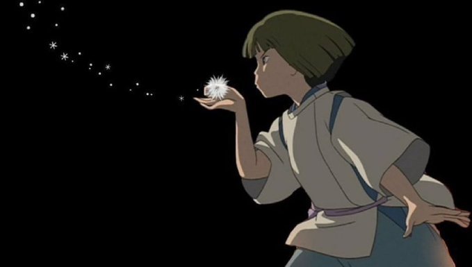 An anime still featuring a character with short hair in traditional clothing holding a glowing, sparkling flower against a black background.
