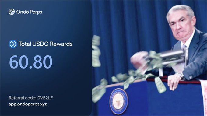 An advertisement for 'Ondo Perps' showing 'Total USDC Rewards' of '60.80' alongside an image of Federal Reserve Chairman Jerome Powell tossing money from a printing press, with a referral code 'OVE2LF' and 'app.ondoperps.xyz'.