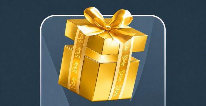 This image shows a golden gift box with "Stake" written on the ribbon, likely promoting a giveaway. The gift box visually represents the "GOLD gift" mentioned in the accompanying post.