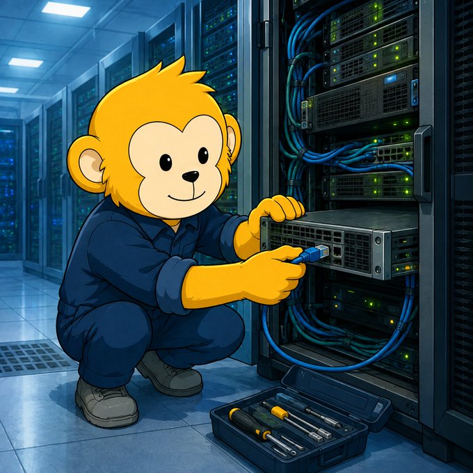 A cartoon illustration of a yellow monkey character in a blue uniform working on server rack equipment in a data center, with a tool kit on the floor.