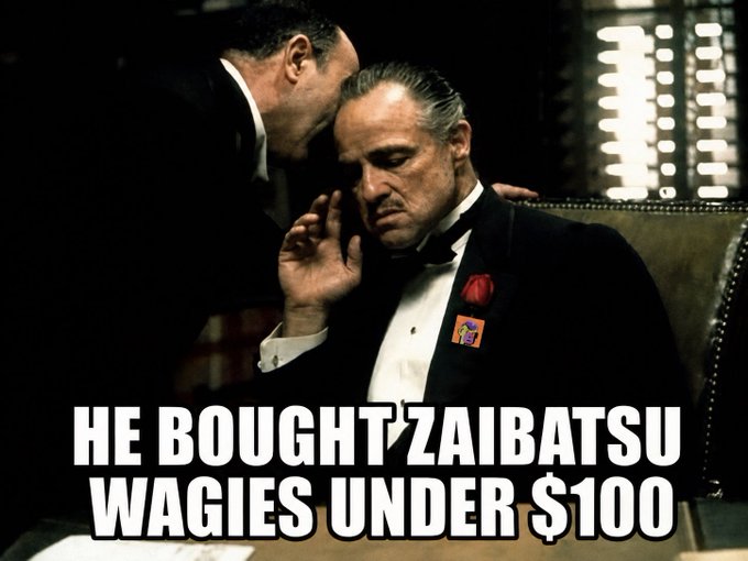 A screenshot from *The Godfather* shows Don Corleone being whispered to while seated, with overlay text reading "HE BOUGHT ZAIBATSU WAGIES UNDER $100," humorously framing the meme poster's early $ZAIBATSU purchase as a shrewd, under-the-radar investment decision.