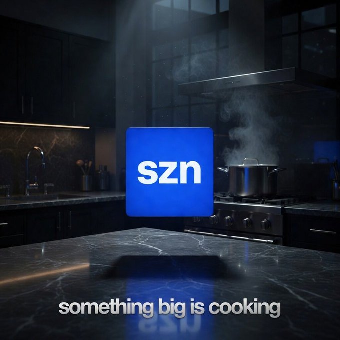 A blue square logo reading 'szn' displayed against a dark kitchen background with a steaming pot, accompanied by the tagline 'something big is cooking'.