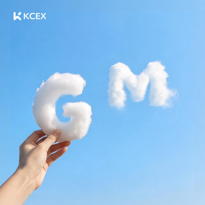 A graphic showing clouds shaped like the letters 'G' and 'M' against a blue sky, with a hand holding the 'G' cloud, branded with the 'KCEX' logo.
