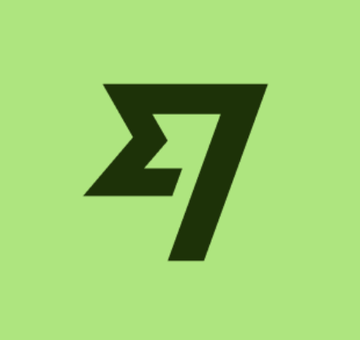 The image displays a stylized "Σ7" logo in dark green on a light green background, which is the branding for WisdomTree, an asset management company. The logo relates to the post as WisdomTree (a financial services firm) appears to be involved in plans to refile a US trust charter under the new GENIUS Act regulatory framework.