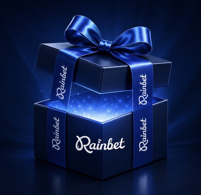 A dark blue gift box tied with a satin ribbon reads "Rainbet" repeatedly across the ribbon and front of the box, with a glowing blue light emanating from inside, visually representing the present being offered to users who reply with their username and follow @JJChizzy as part of the Rainbet promotion.