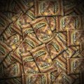 A dense, repeating pattern of US dollar bills fills the frame.