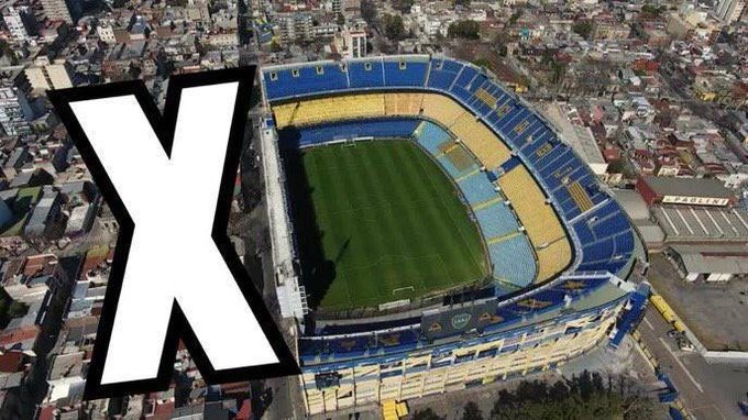 An aerial view of a blue and yellow football stadium, likely Boca Juniors' La Bombonera, with a large white 'X' logo overlay.