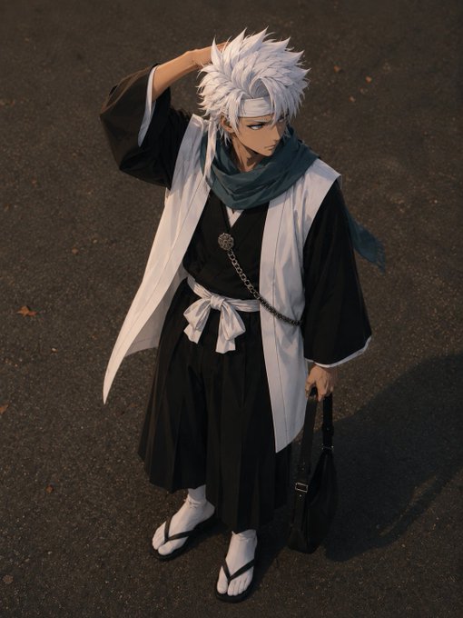 A cosplayer dressed as an anime character with white spiky hair, wearing a black and white traditional robe with a green scarf, standing on a road.