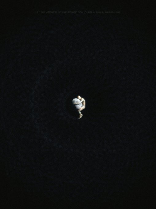 A minimalist dark image with a small figure curled up in the center, featuring faint text at the top that reads 'LET THE SILENCE OF THE INFANTS TEAR US WITH A SMALL HARMFUL TEAR'.