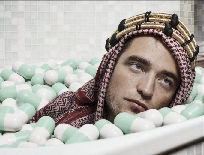 A man wearing a keffiyeh and traditional Arabian headdress is submerged in a bathtub filled with teal and white capsules, appearing unimpressed or exhausted. The image humorously illustrates the frustration of trying to give trading advice to followers who, despite watching his growth from 2 SOL to 7 figures, may not absorb or act on the guidance—symbolizing the "capsules" of wisdom going over their heads.