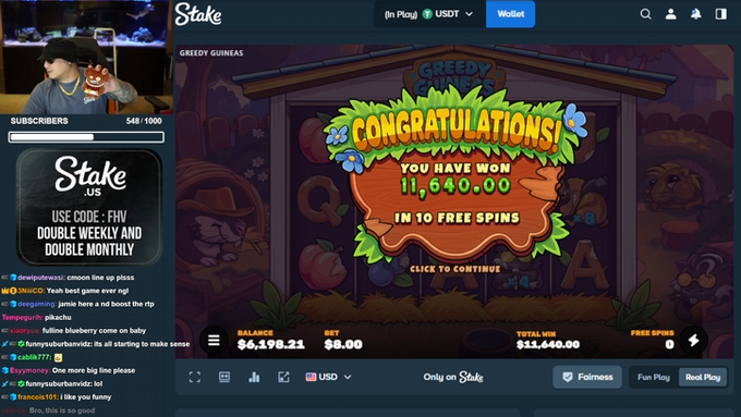 A Twitch streamer celebrates winning 11,640.00 free spins on the "Greedy Guineas" slot game at Stake, with the chat showing excited reactions and a promo code for Stake.us displayed on screen.