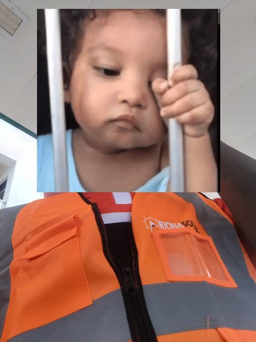 A photo of a person wearing an orange and gray work vest with a sad toddler image overlaid, creating a humorous comparison.