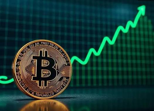 A physical Bitcoin token sits in the foreground against a backdrop of a green upward-trending stock chart, visually reinforcing the post's "75k BITCOIN" message by symbolizing Bitcoin's price climbing toward the $75,000 milestone.