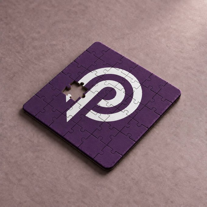 A nearly complete purple jigsaw puzzle featuring a white spiral design rests on a textured beige surface, with one piece missing.