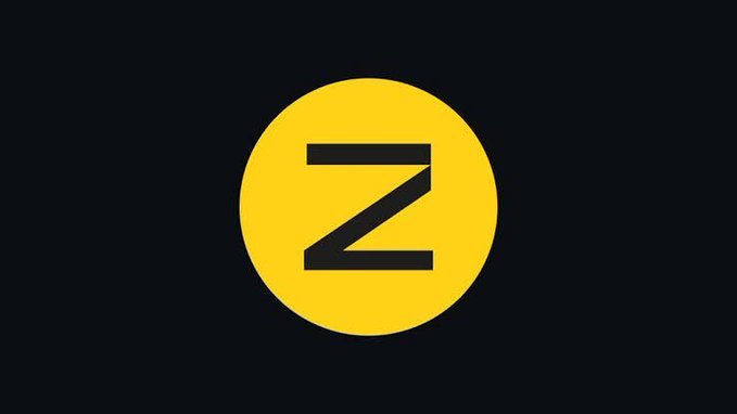 A bright yellow circular logo with a bold black "Z" sits centered on a dark gray background, representing the privacy-focused protocol Zama. The minimalist branding accompanies news of Zama's total value locked (TVL) surging 114% over the past month, surpassing $46M.