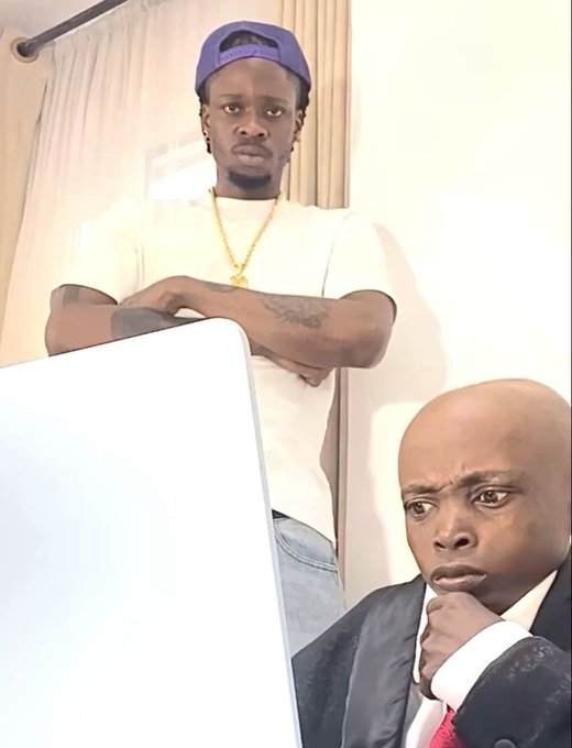 Two men are shown in a candid indoor shot—one standing behind a laptop in a white t-shirt and blue cap, the other seated in a suit with a pensive, hand-on-chin expression, visually reflecting the post's motivational "Happy new week" message about staying active and grinding.