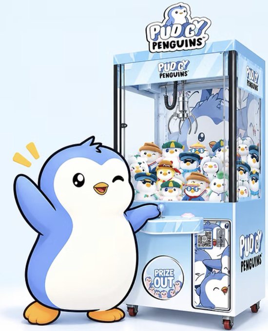 An advertisement for 'Pudgy Penguins' featuring a claw machine filled with various penguin plush toys next to a cartoon penguin mascot.