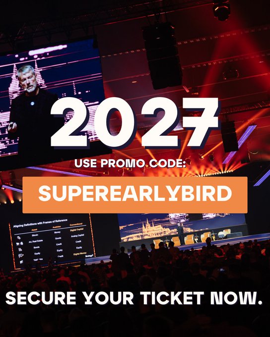 The image features a large screen with a speaker, possibly at an event or conference. A banner displays the text "2027 Use Promo Code: SuperEarlyBird". The background of the image shows a crowd of people gathered for an event, indicating that this is likely taking place in a venue like a convention center or a large auditorium.