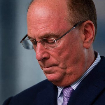 A close-up shows an older man with glasses and a purple tie looking downward with a somber expression. The image appears to depict a BlackRock executive, fitting the breaking news that the firm has just sold $202.2 million worth of Bitcoin.