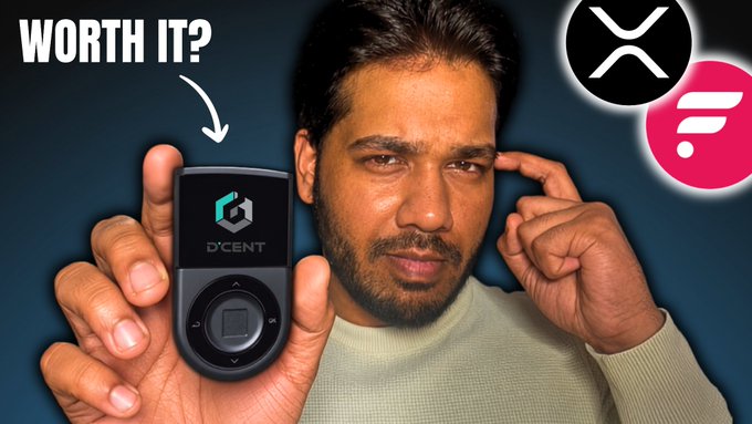 A man holds up a D'CENT Biometric Wallet, with the XRP and FLR crypto symbols visible, under the question "WORTH IT?".