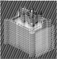 A pixelated, low-resolution grayscale image depicting a rectangular box or structure with vertical lines on top, possibly representing a building or container.