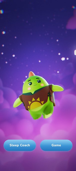 A green cartoon dinosaur-like character wearing a brown sun shirt floats against a starry purple sky, with buttons labeled 'Sleep Coach' and 'Game' at the bottom.