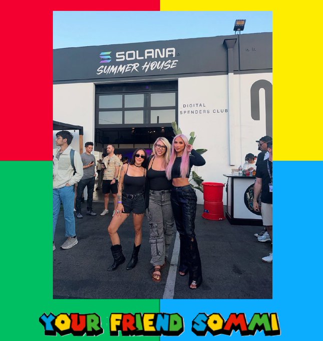 Three women pose outside the "Solana Summer House" branded "Digital Spenders Club" venue, with the image framed by "Your Friend Sommi" graphics and colorful blocks. The scene ties to the post's criticism of Solana bag-holders ignoring bearish "top signal" indicators while awaiting the projected $1000 price target championed by their favorite KOLs.