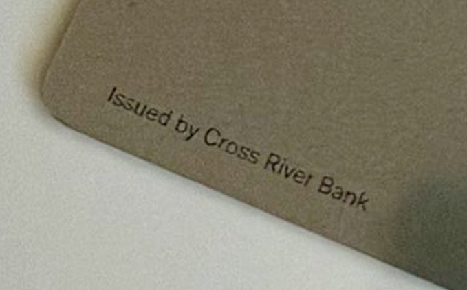 The image shows a close-up of a card corner printed with "Issued by Cross River Bank," confirming that the X Money card is issued by Cross River Bank, a fintech institution that partnered with Ripple in 2014 to use the Ripple protocol for real-time international payments.