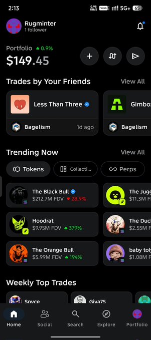 A screenshot of a crypto trading app showing the 'Rugminter' profile with a portfolio of $149.45, sections for 'Trades by Your Friends', 'Trending Now' featuring tokens like 'The Black Bull', 'Hoodrat', and 'The Orange Bull', and 'Weekly Top Trades'.