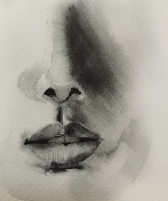 A charcoal or graphite sketch drawing of a face featuring prominent lips and a nose, with abstract shading and distinctive nostrils.