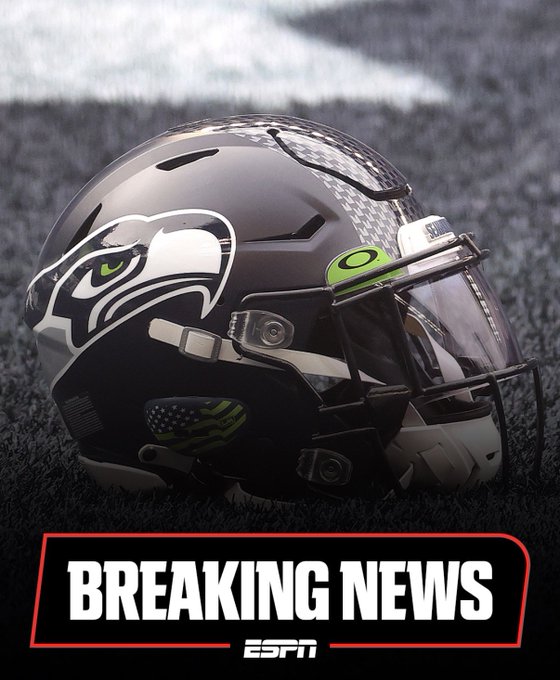 A Seattle Seahawks football helmet sits on the turf with a "BREAKING NEWS" ESPN graphic at the bottom. The image ties to the post by humorously framing the Seahawks as breaking news-worthy, playing on the joke of the team being a more valuable (or absurd) investment than all the world's NFTs.