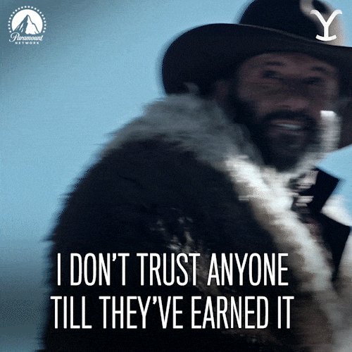 The image features a man wearing a cowboy hat, a fur coat, and a black jacket with white trim. He has a beard and mustache, giving him a rugged appearance. The background of the image is blue, which contrasts with his attire. There are two texts in the image that read "I don't trust anyone but me" and "I trust no one except for me". These texts seem to be related to the man's character or situation within the post.