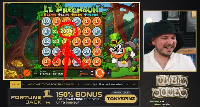 A live stream of 'Le PRECHAUN' slot game featuring a streamer wearing a bucket hat, with a 150% bonus promotion for FortuneJack using promo code TONYSPINZ.