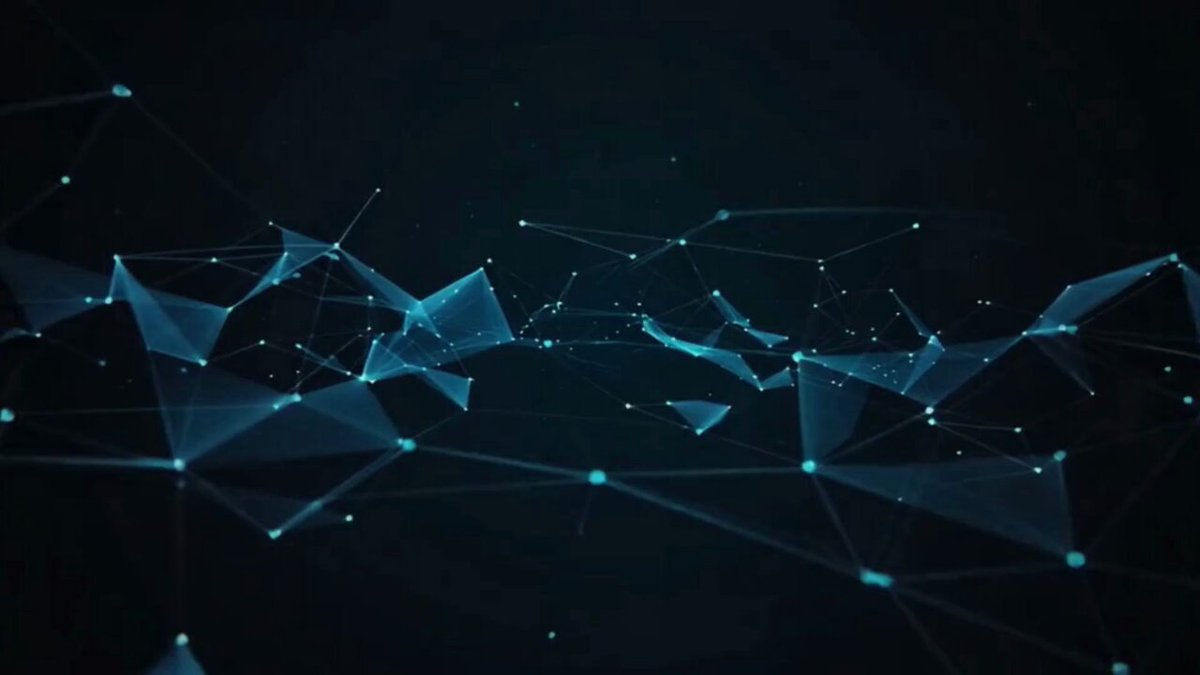 The image shows a close-up view of a complex network of blue lines, possibly representing connections or relationships between different elements. The background appears to be black with white dots scattered throughout, creating an abstract pattern that adds depth and complexity to the scene. The image is titled "This Week in Theta" and includes a caption about why everything in crypto is down right now.