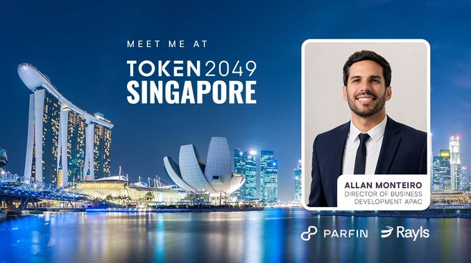 A promotional banner reading 'MEET ME AT TOKEN2049 SINGAPORE' featuring Allan Monteiro, Director of Business Development APAC, with logos for Parfin and Rayls at the bottom against a Singapore skyline background.