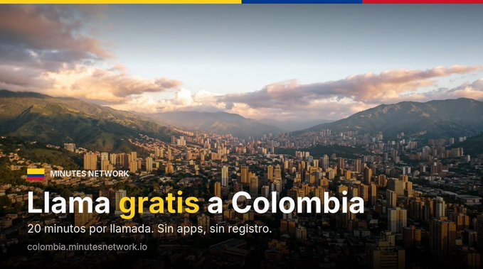 An advertisement for Minutes Network offering free calls to Colombia, featuring an aerial view of a city in a mountain valley with Colombian flag colors at the top.