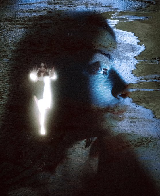 An artistic double-exposure style image blending a close-up of a woman's eye with the silhouette of a glowing figure standing on a dark shoreline.