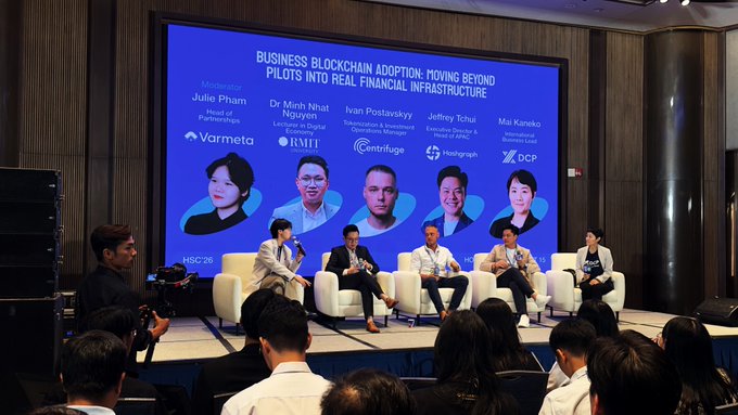 Panel discussion titled 'Business Blockchain Adoption: Moving Beyond Pilots Into Real Financial Infrastructure' at HSC'26, featuring Julie Pham (Varmeta), Dr Minh Nhat Nguyen (RMIT), Ivan Postavskiy (Contribute), Jeffrey Tchui (Hashgraph), and Mai Kaneko (DCP).